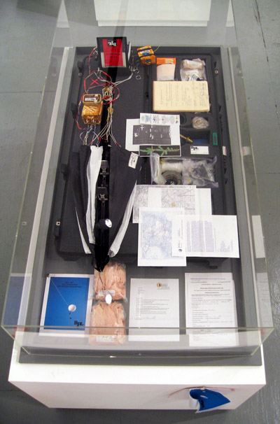 <i>BPL-001 Mission (Conrad Carpenter Funeral)</i>, 2007, waterproof case with objects comprising near space vehicle, aluminum, nylon, polycarbonate, dacron, mylar, electronics, steel, brass, paper, urethane, 6 x 53 x 16 inches (15 x 135 x 40.5 cm)