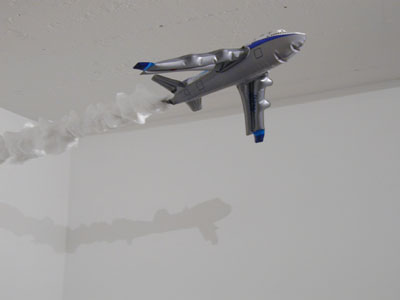 <i>Un Peu d'air</i>, 2003, mixed media, plastic airplane, cotton, air pump, steel, cable, edition of 10