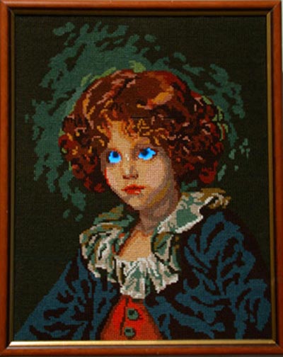 <i>Canevas Electronique (Enfant)</i>, 2001, mixed media, video object, tapestry cotton, LCD screen, DVD