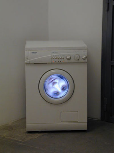<i>Lessive raciale</i>, 2002, installation, video object, wash machine, TV, DVD player, 23 5/8 x 22 13/16 x 33 1/16 inches (60 x 58 x 84 cm), edition of 5
