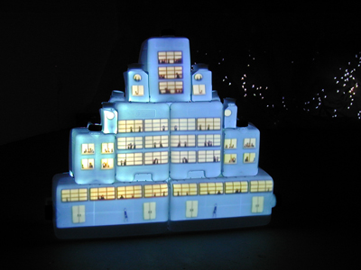 <i>Plastikcity</i>, 2005, video projection, plastic containers, rivets, steel, 39 1/2 x 46 x 9 1/4 inches (100.3 x 116.8 x 23.5 cm)