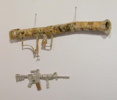 Kurt Novak, <i>Bazooka</i>, newspaper, resin, metal and <i>M4 carbine</i>, 2003