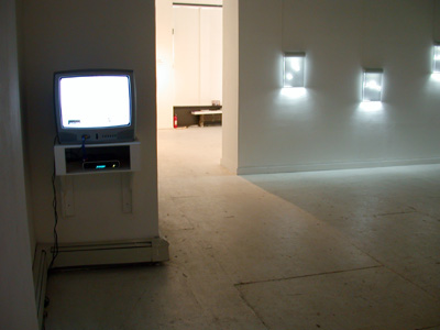 Exhibition view from left to right: installation view of <i>Escape Vehicle no7</i>, 2005, video still, Mpeg files + DVD, 7 min, edition of 5; series <i>Antarctica Dispatches</i> etched drawing on acrylic mounted in light housing, edition of 5, 17x12 ins (43x30.5 cm) each
