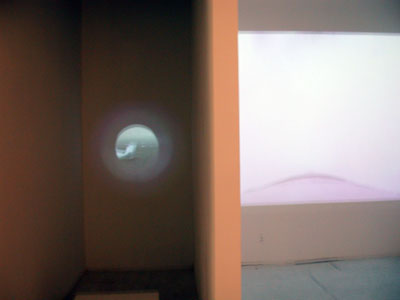 Exhibition view from left to right: installation view of <i>44</i>, 2005, video still, Mpeg files + DVD, 44min., edition of 5; installation view <i>Falling</i>, 2005, video still, Mpeg files + DVD loop, 5min, edition of 5